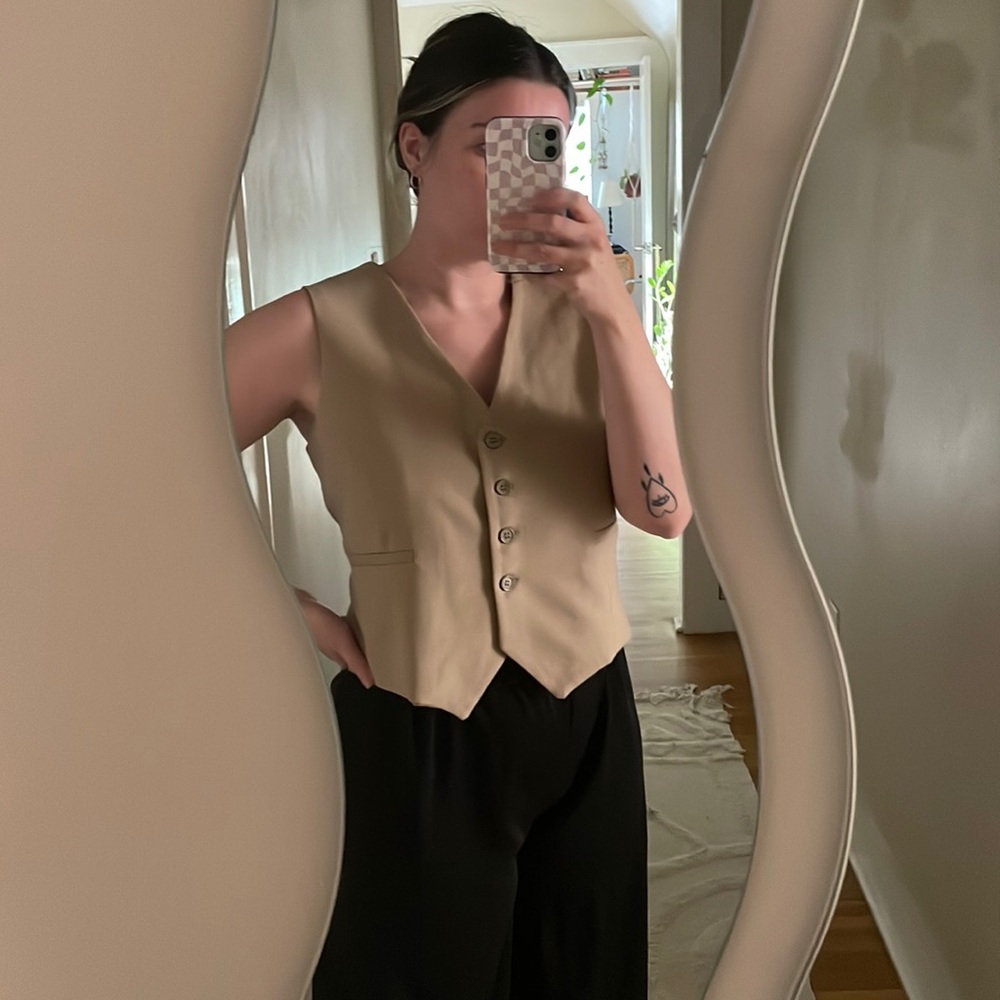 Boohoo brand button up vest.